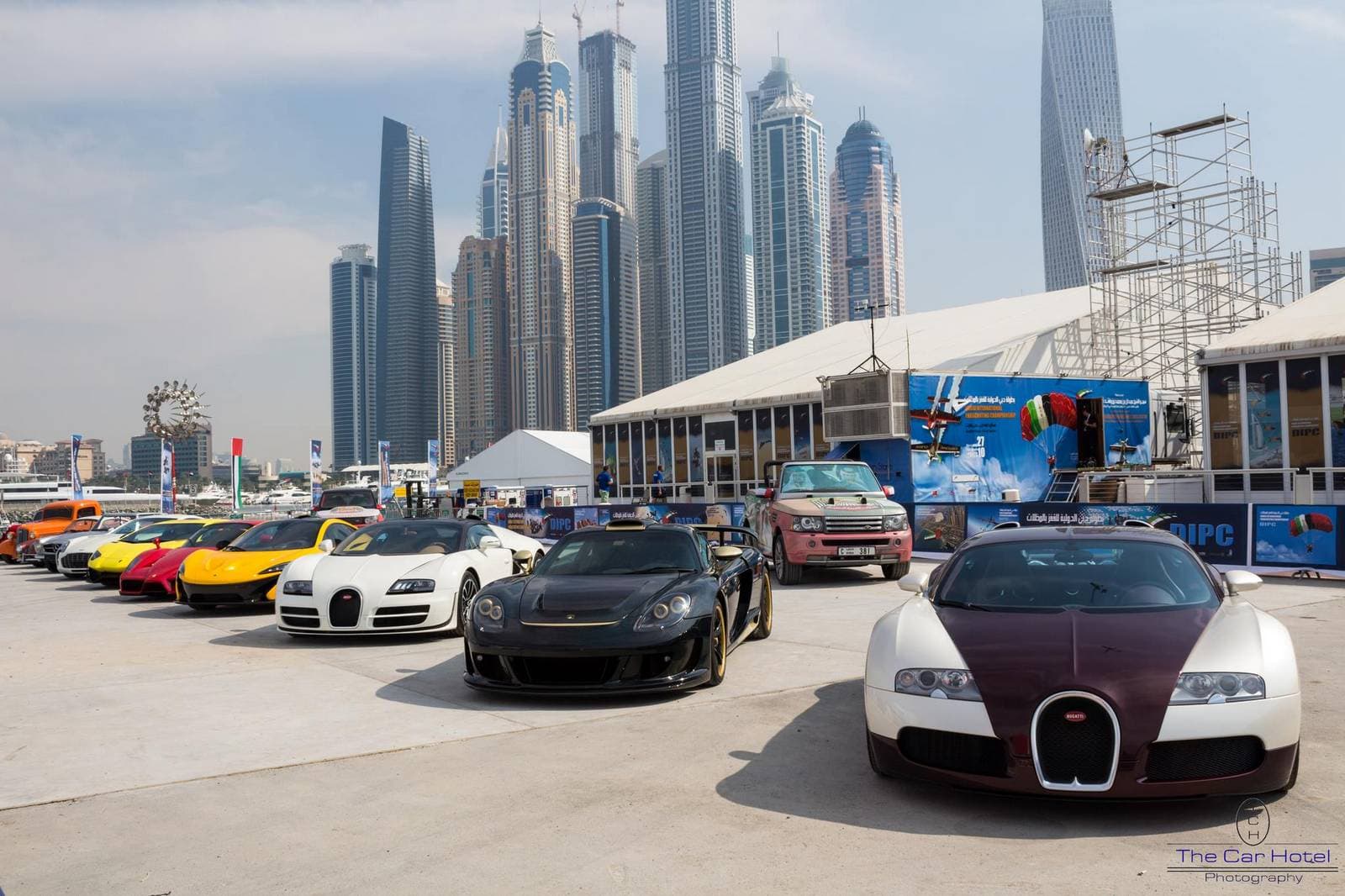 Supercars lined up on a Dubai street at night