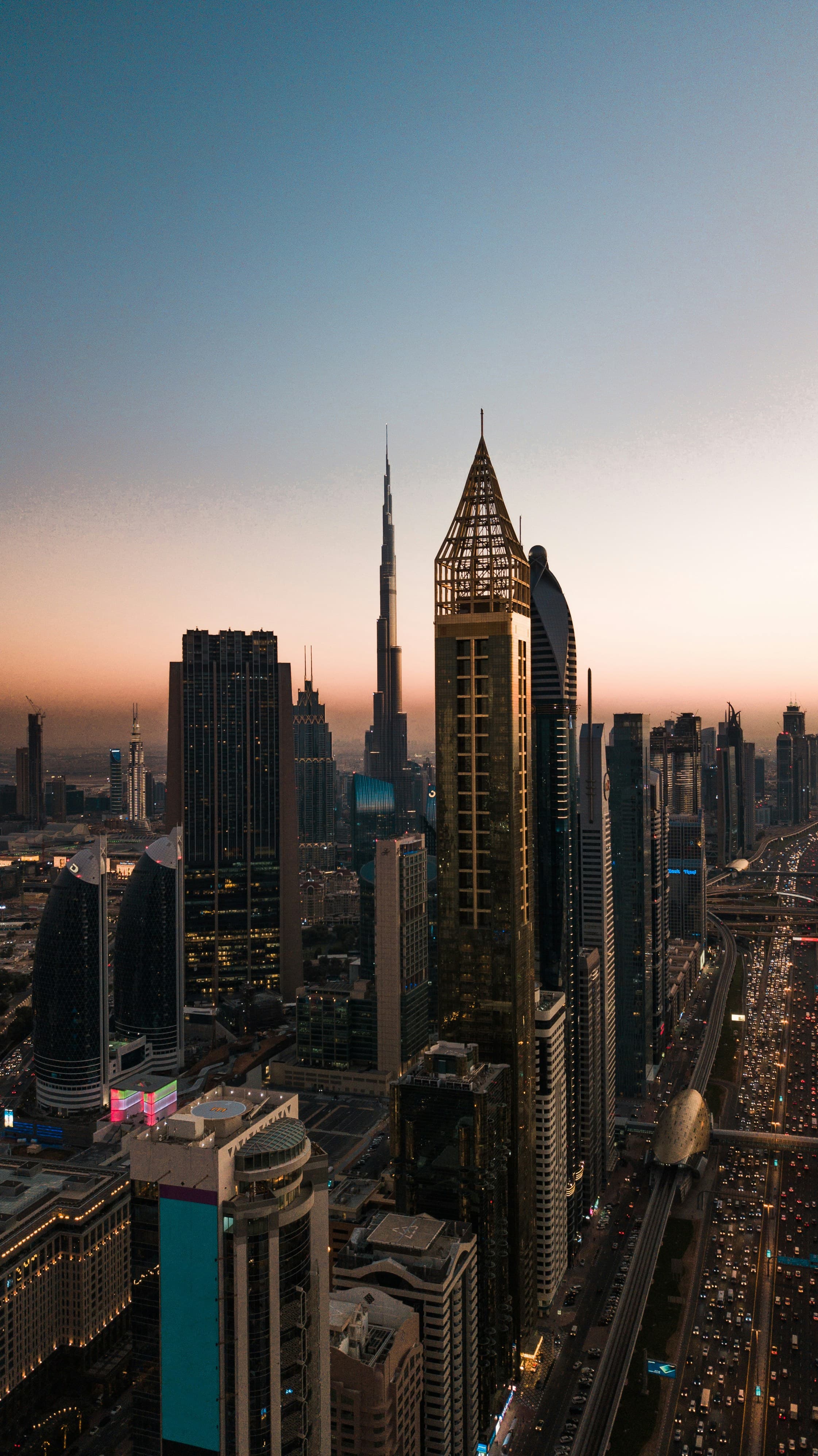 Sheikh Zayed Road at dusk with the Burj Khalifa — Dubai's main artery where most Salik toll gates sit